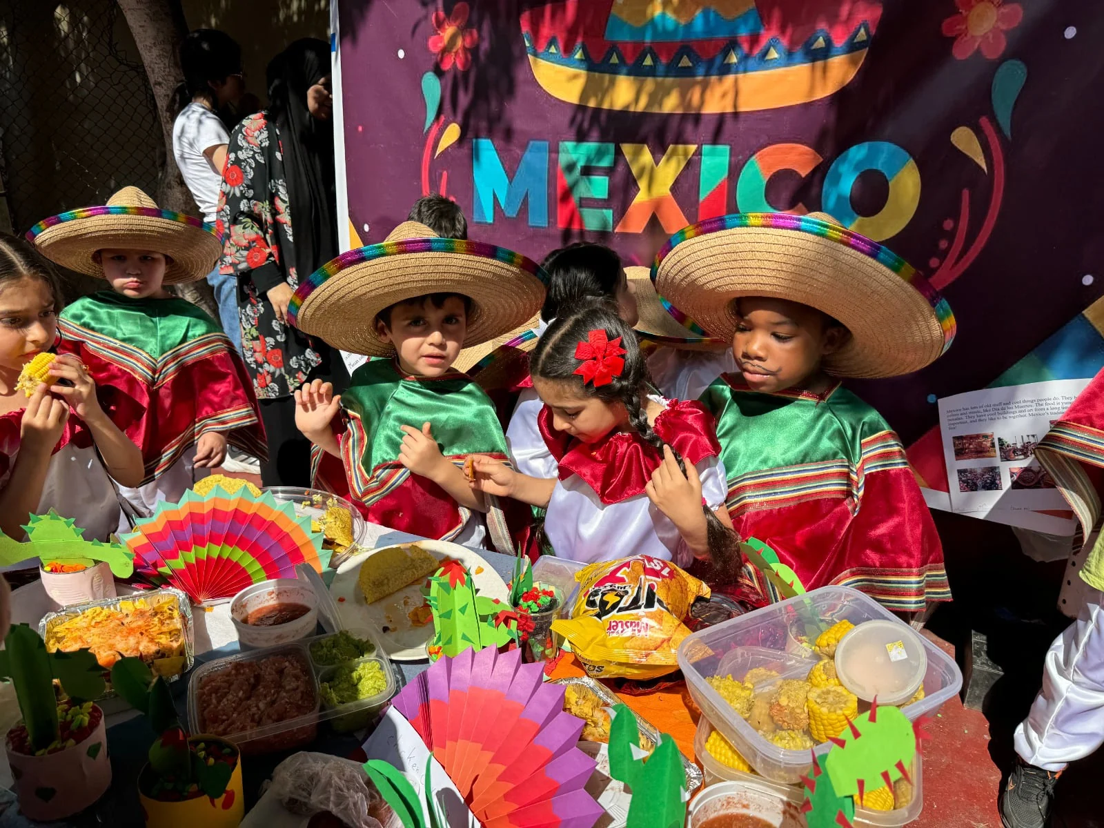 Young students presenting Mexico with colorful costumes at Culture Day